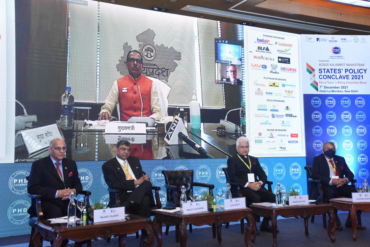 Shivraj Singh Chauhan, Hon'ble Chief Minister, Madhya Pradesh, addressing the PHDCCI States' Policy Conclave. From L-R: Rajiv Talwar, Former President, PHDCCI; Sanjay Aggarwal, Immediate Past President, PHDCCI; Padeep Multani, President, PHDCCI; and Saurabh Sanyal, Secretary General, PHDCCI.